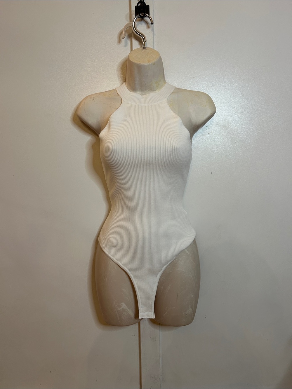 Sleeveless Ribbed High-Neck Bodysuit in White